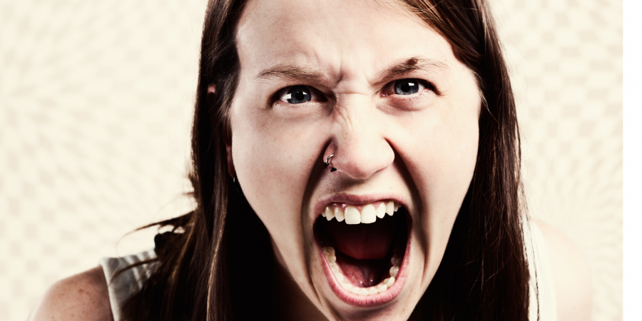 furious-young-woman-shouts-and-yells-picture-id499998959